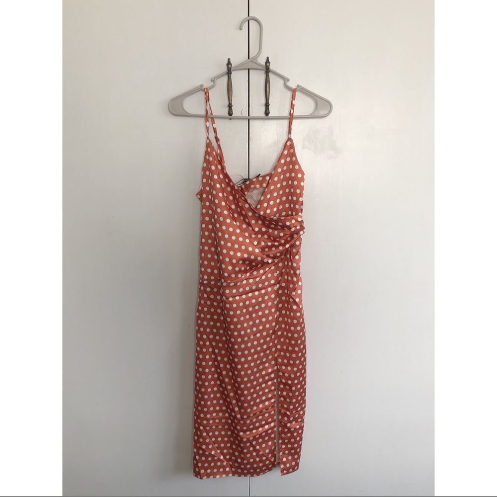 Midi burnt orange polka dot dress.